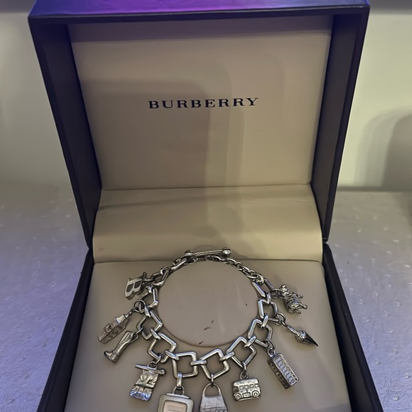 Authentic Burberry charmed watch bracelet in silver.